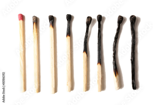 Burnt matches isolated on white photo