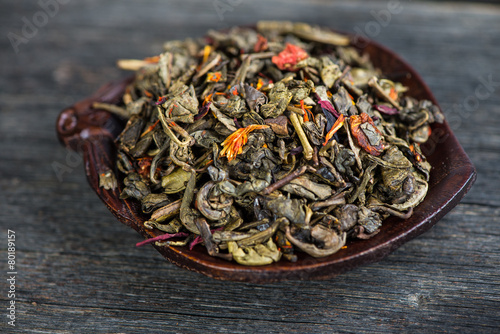 Aromatic antioxidant green tea on wooden board