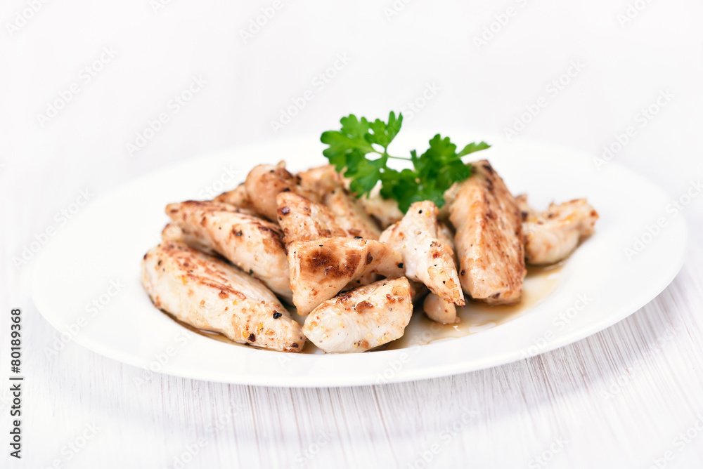 Chicken meat sliced on white plate