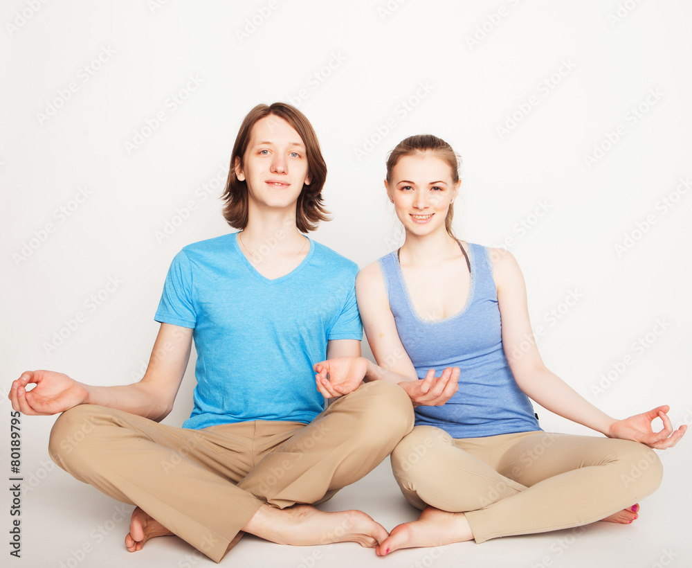 Young couple in yoga pose