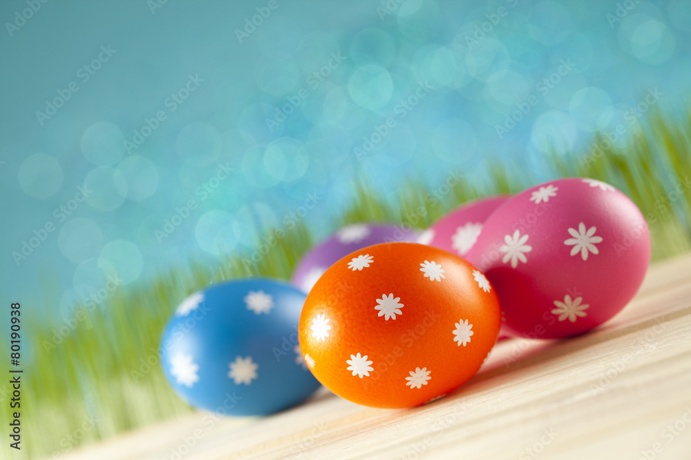 Fototapeta premium Colored Easter eggs on blue background