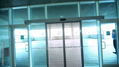 Motion through sliding glass doors in business center photo
