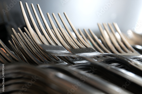 Forks arranged in series on the kitchen table.