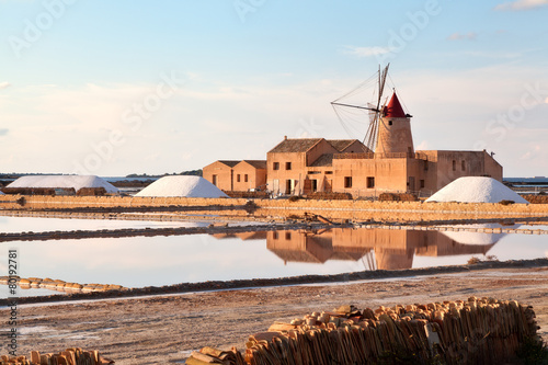 Windmill at sunset in the saltern of Marsala, Sicily