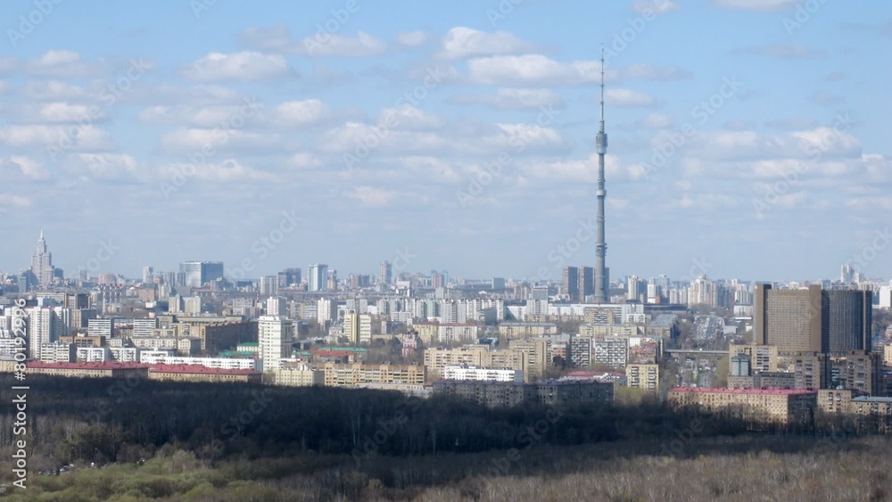 Aerial view of city with big tower and clouds, timelapse Aerial view of city with big tower and clouds, timelapse