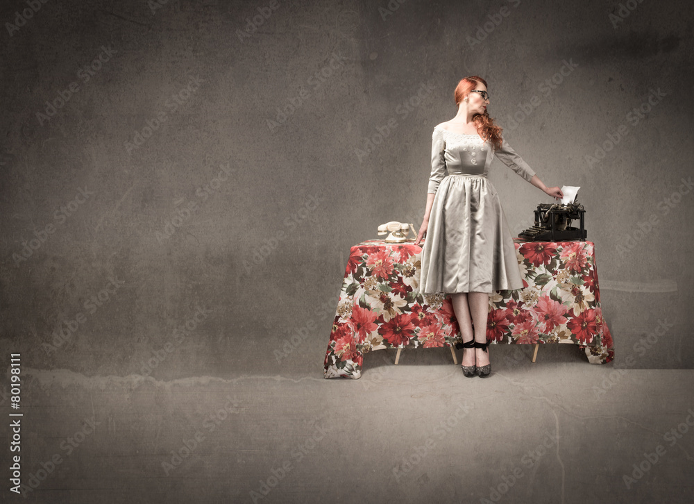 woman standing near work desk