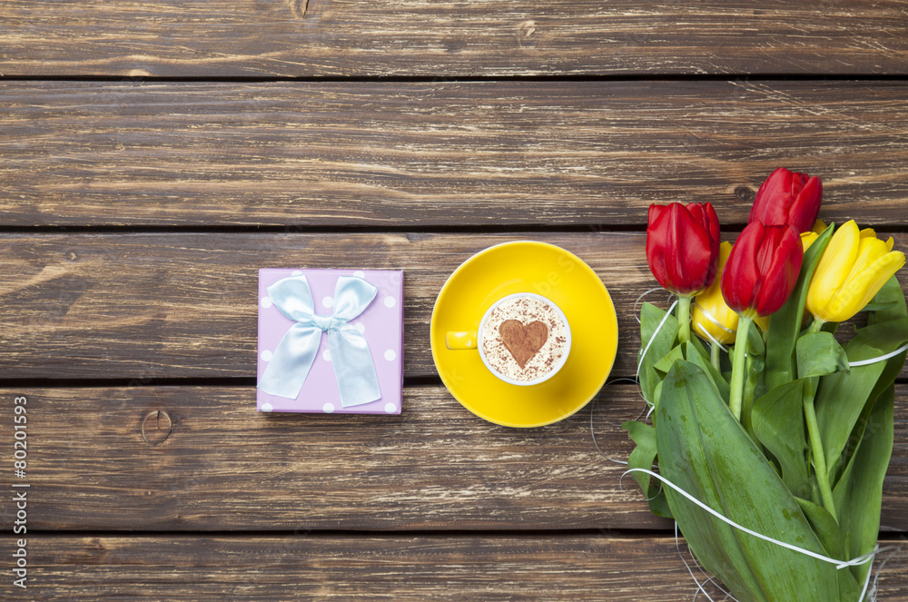 cappuccino with heart shape and bouquet of tulips cappuccino with heart shape and bouquet of tulips