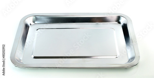 Empty silver tray on white background © kuarmungadd