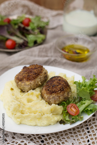Meatballs cutlets with mashed potatoes and salad