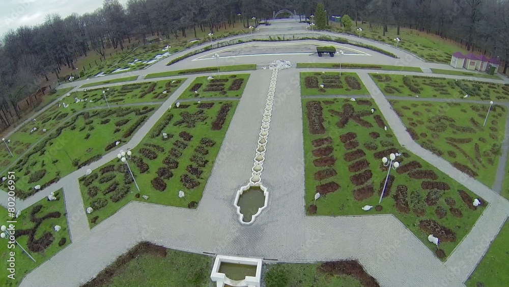 Territory of rose garden with paved paths and flowerbeds Territory of rose garden with paved paths and flowerbeds