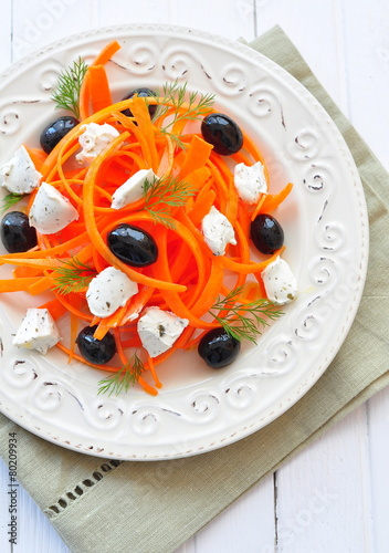 Carrot pasta salad with feta, olivs and dill photo