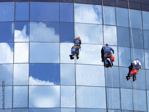 Workers washing a skyscraper windows