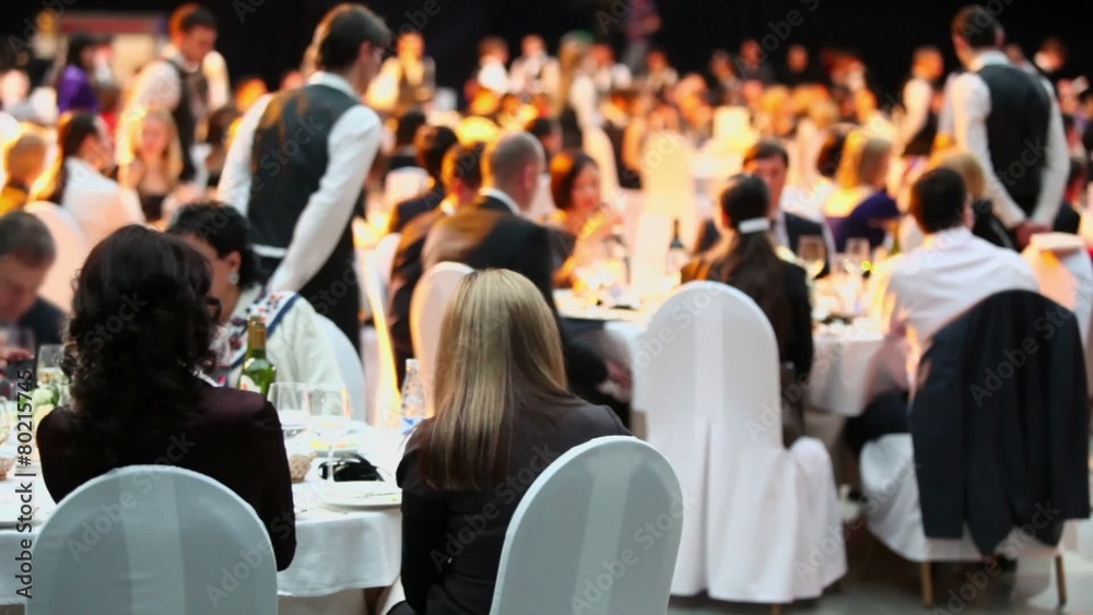 People sit at tables during Ceremony of rewarding of winners People sit at tables during Ceremony of rewarding of winners
