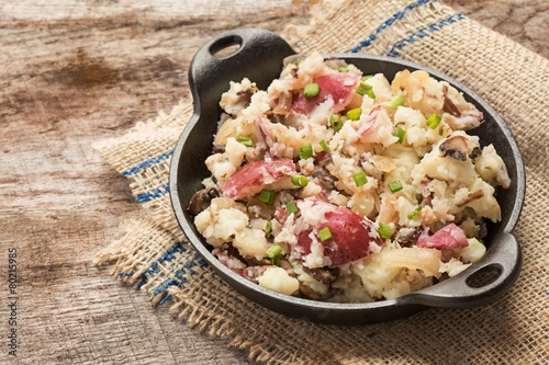 Smashed red potatoes with fried onions and mushrooms