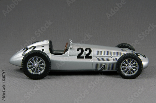old race car isolated on grey