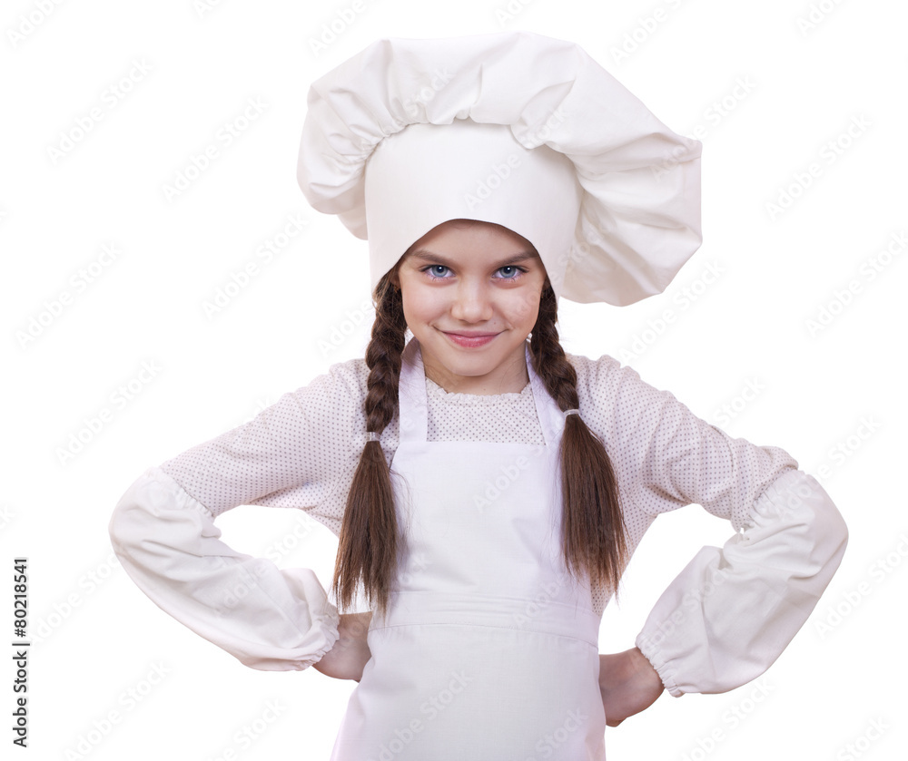 Cooking and people concept - smiling little girl in cook hat Cooking and people concept - smiling little girl in cook hat