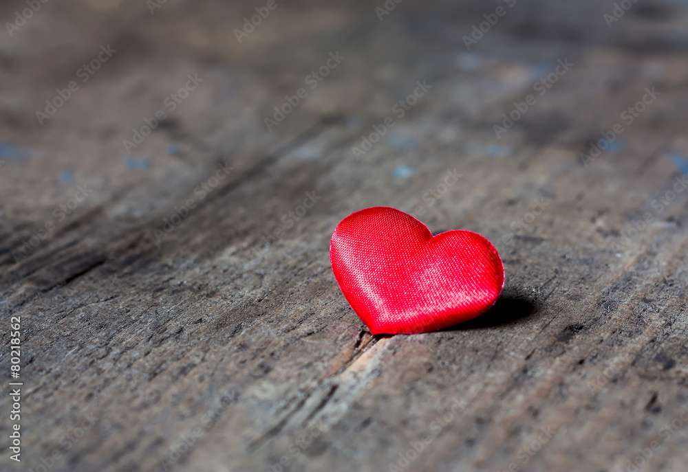 Red heart on a wooden surface Red heart on a wooden surface