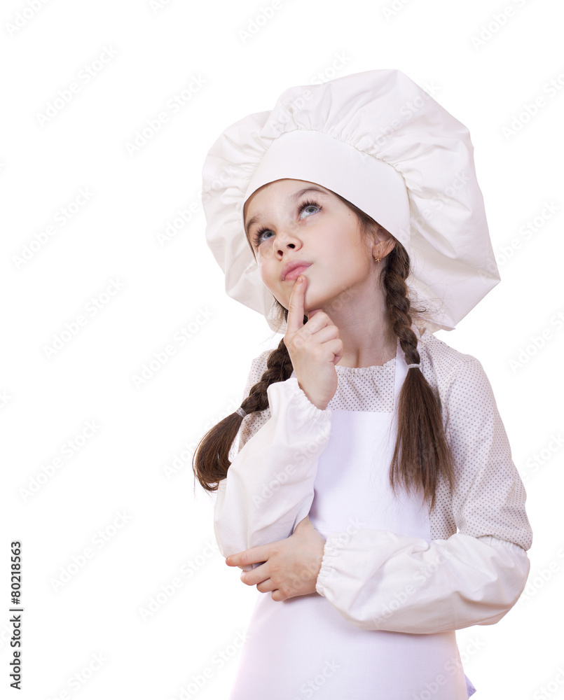 Cooking and people concept - smiling little girl in cook hat Cooking and people concept - smiling little girl in cook hat