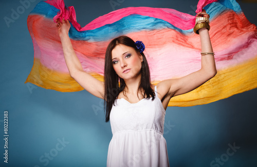 summer woman with colored shawl on blue