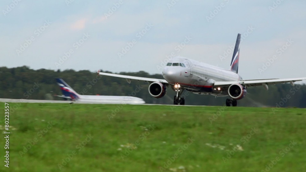 Russian passengers aircraft takes off from runway at airport Russian passengers aircraft takes off from runway at airport