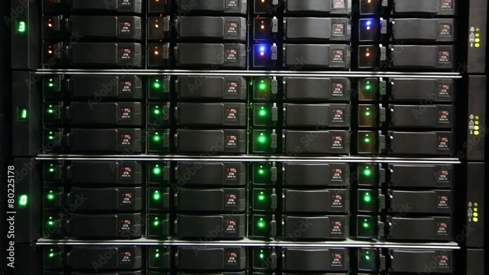 Rack of data server with many hard drives and LED lamps blinks Rack of data server with many hard drives and LED lamps blinks