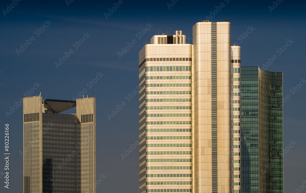 Facades of dynamic skyscrapers in Frankfurt, Germany, at sunset Facades of dynamic skyscrapers in Frankfurt, Germany, at sunset
