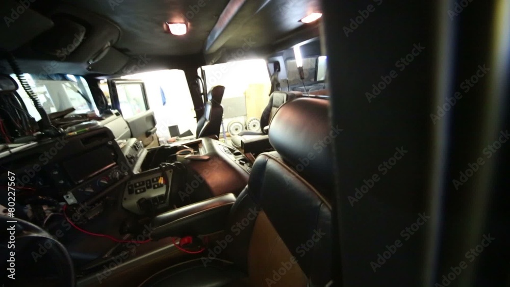 Inside view broken car interior with chairs and steering wheel Inside view broken car interior with chairs and steering wheel