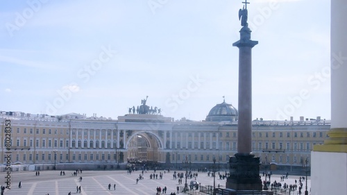 Tourists walking in Palace square in front of hermitage in Sankt Petersburg, on Apr 06, 2013 in Sankt Petersburg, Russia. photo