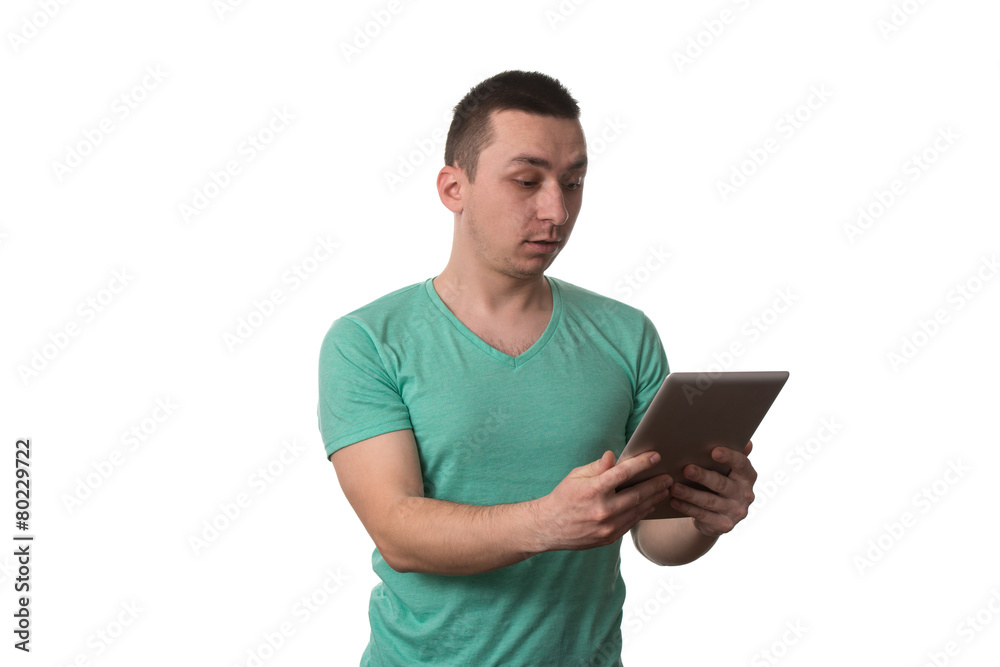 young Man Using Taplet Pc On White Background young Man Using Taplet Pc On White Background
