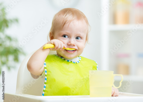 baby child sitting in chair...