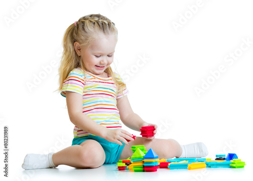 child girl with toy blocks ...