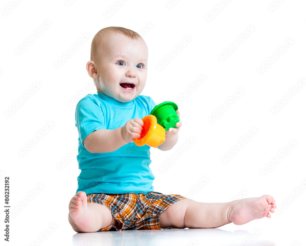 funny baby playing with colourful cup toys, isolated over white funny baby playing with colourful cup toys, isolated over white