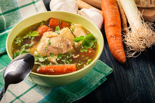Chicken broth with noodles and carrot