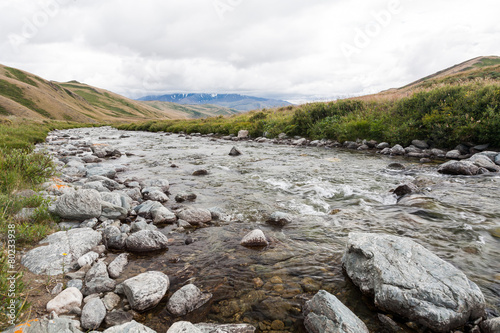 Mountain, river with blue sky and clouds