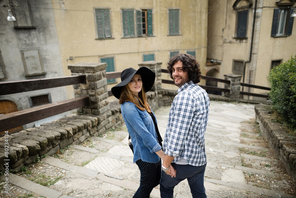 Beautiful couple enjoying themselves in the Italian streets Beautiful couple enjoying themselves in the Italian streets