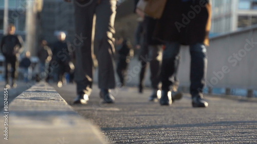 Pedestrians in slow motion in the city. Find similar clips in ou