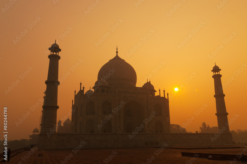 Taj Mahal in the fog at sunrise
