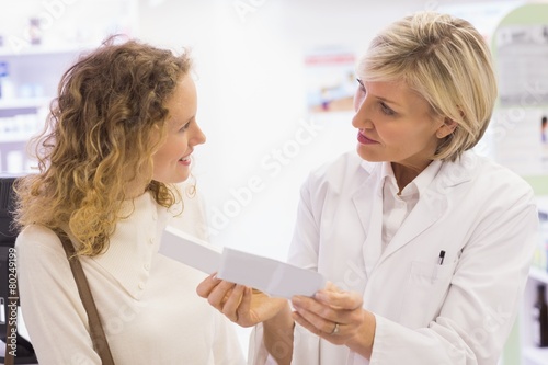 Pharmacist explaining the prescription to patient