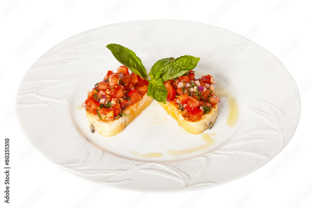 Bruschetta with red tomatoes and green basil