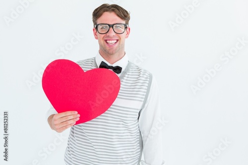 Geeky hipster holding heart card © WavebreakMediaMicro
