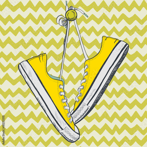 Hand drawn sketchy yellow sneakers on chevron background