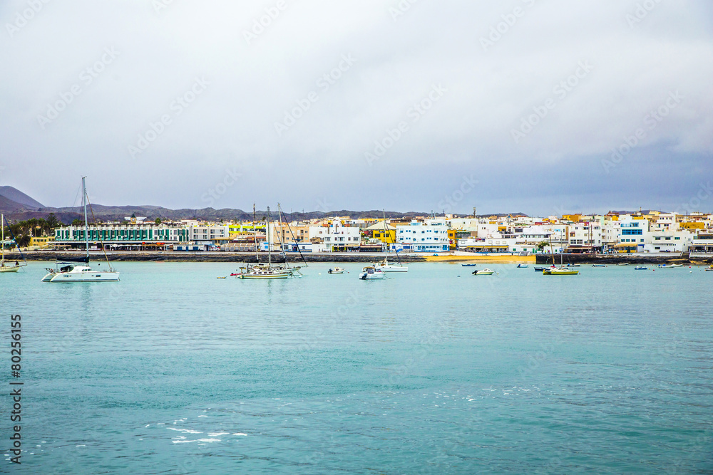view to harbor village Corralejo in Fuerteventura with boats