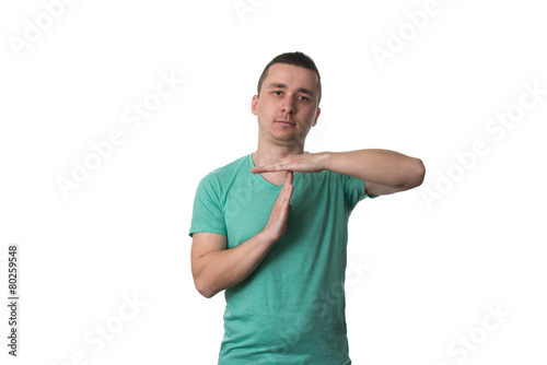Portrait Of Young Man Gesturing Time Out Sign