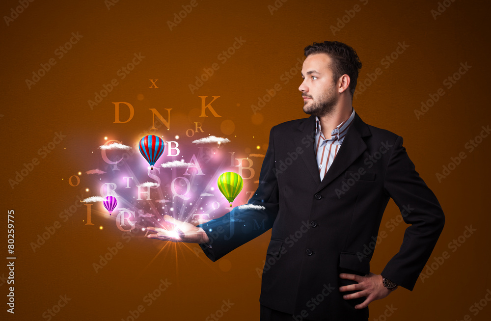 Letters and balloons in the hand of a businessman Letters and balloons in the hand of a businessman