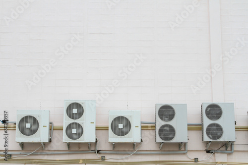 Air compressor fan ventilator on wall.