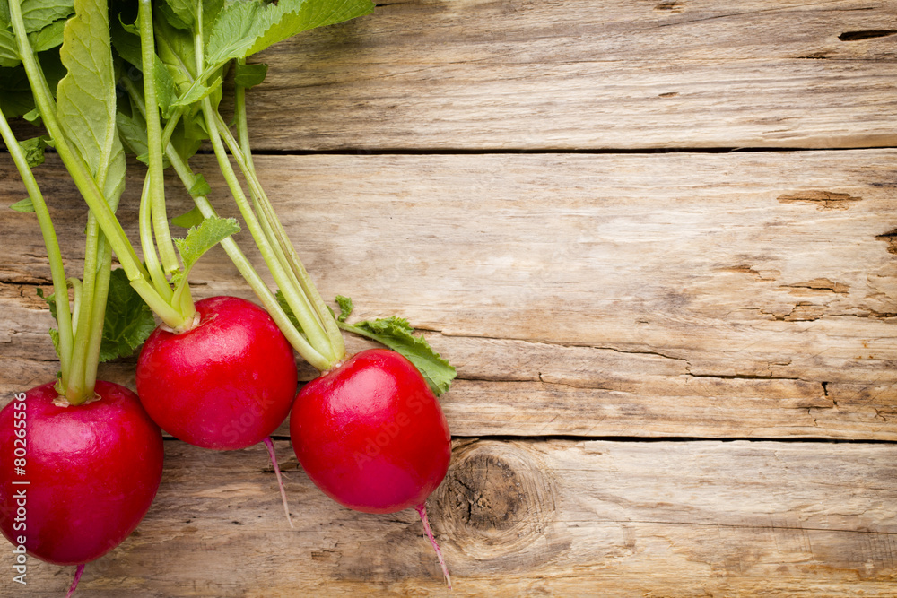Radish on the wooden table. Radish on the wooden table.