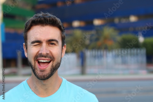 Portrait of a cute man winking