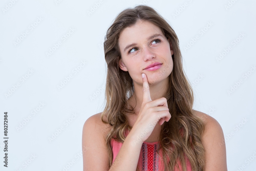 Thoughtful woman with finger on chin Thoughtful woman with finger on chin