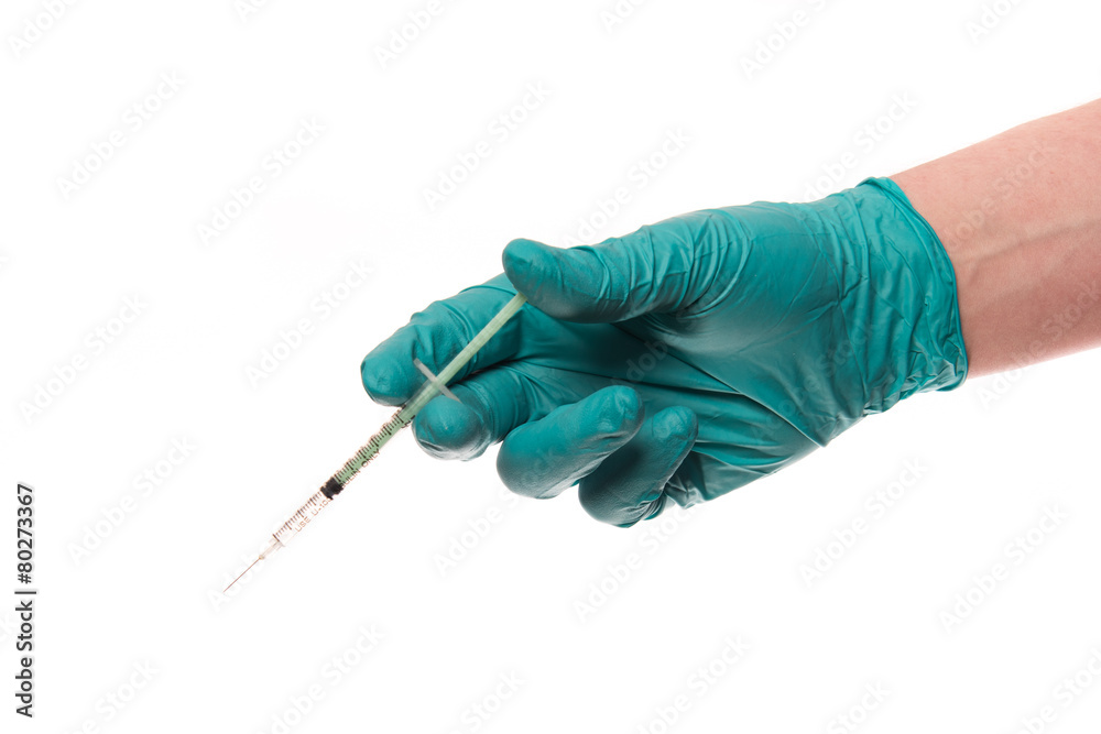 Hand with glove hold a syringe Hand with glove hold a syringe