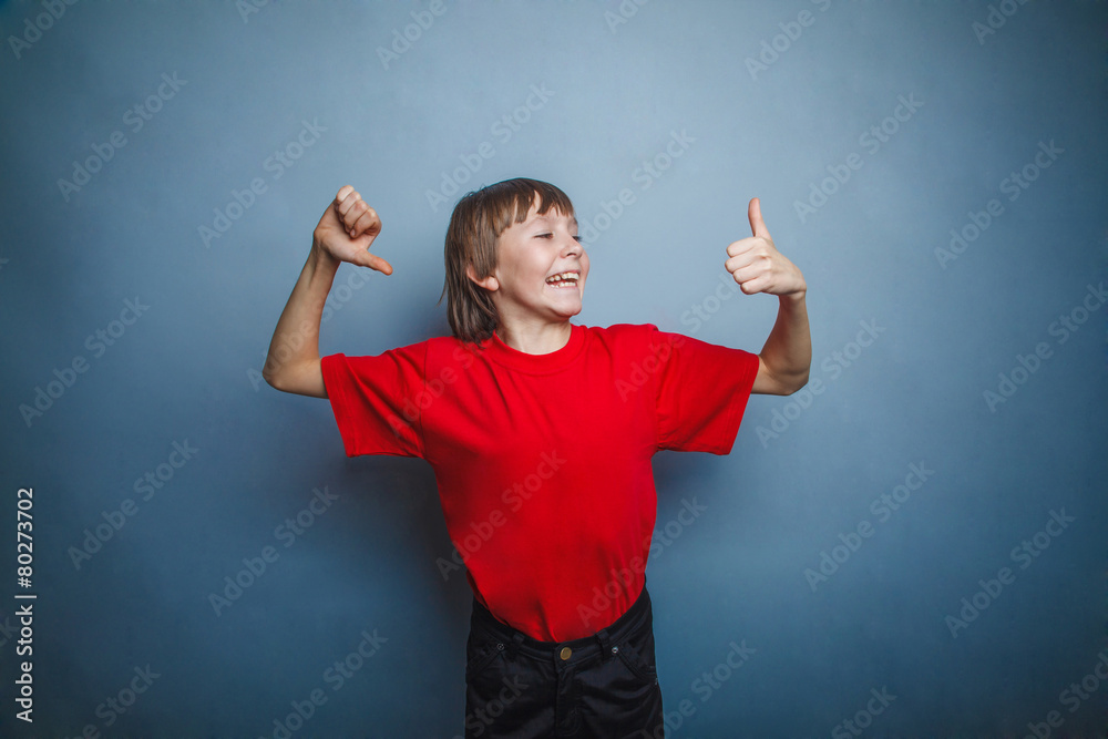 boy, teenager, twelve years old, in a red t-shirt, looking to th boy, teenager, twelve years old, in a red t-shirt, looking to th